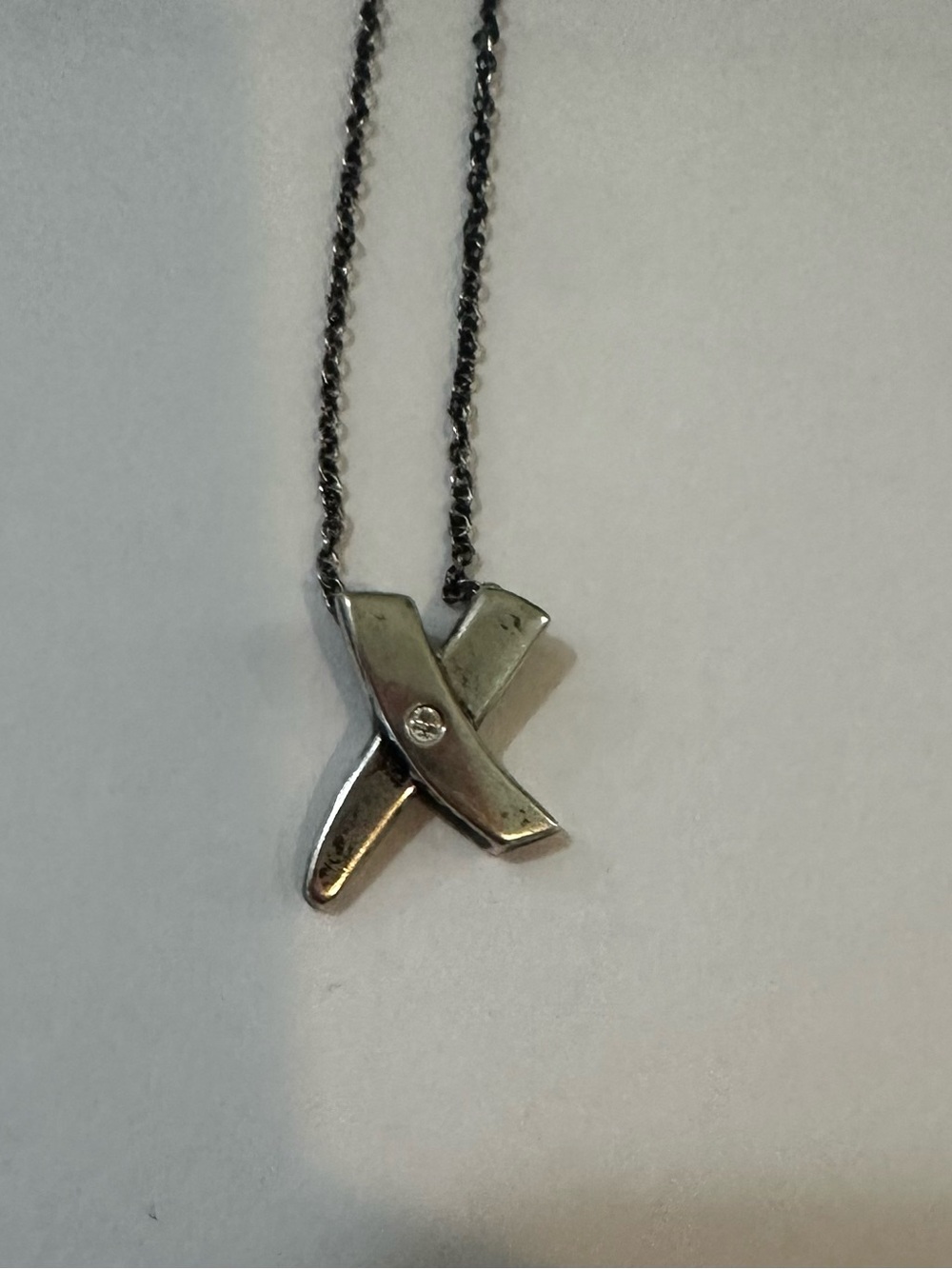 Tiffany and Co. Sterling Silver X (kiss) and diamond necklace